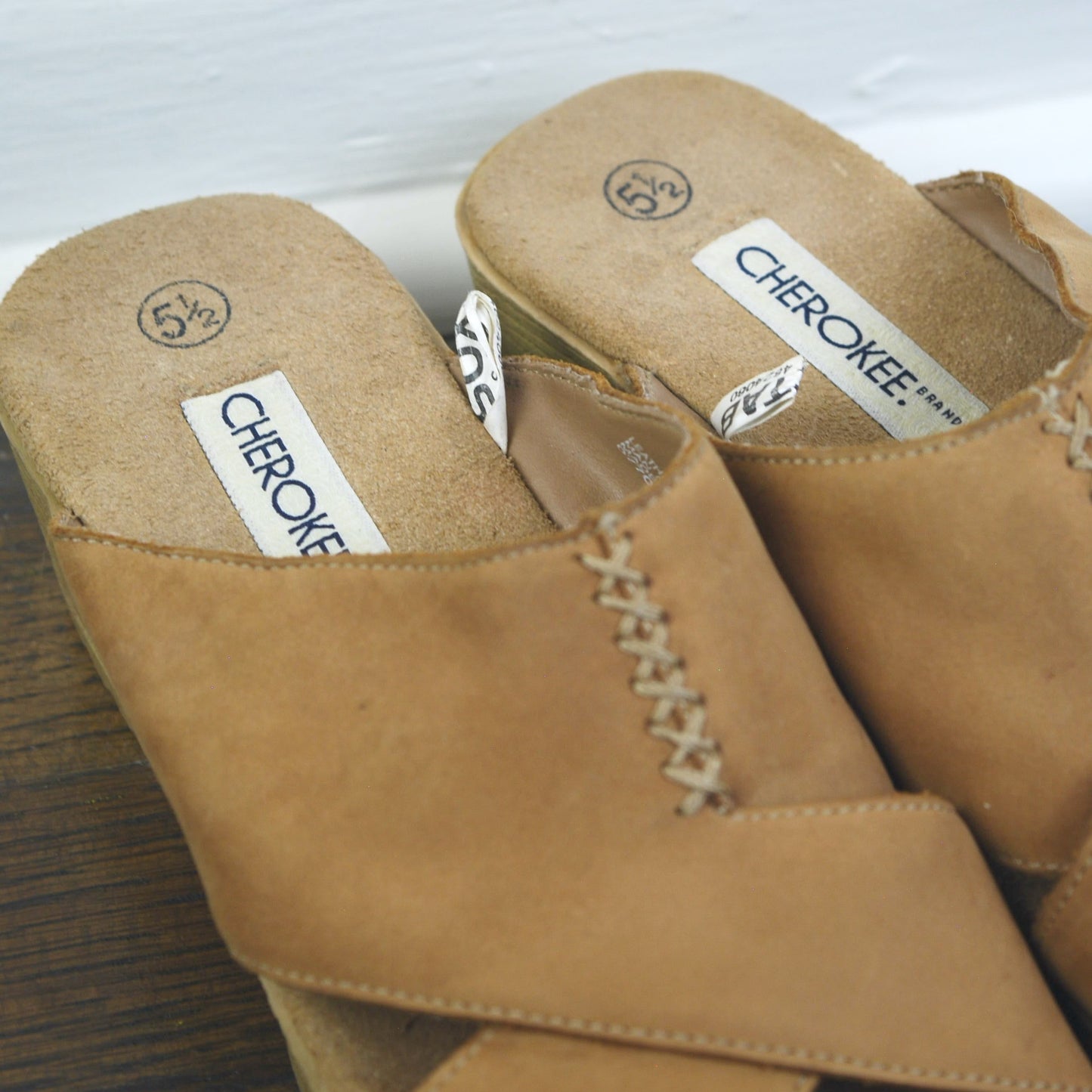 Pair of tan sandals with 'Cherokee' branding on a white surface.