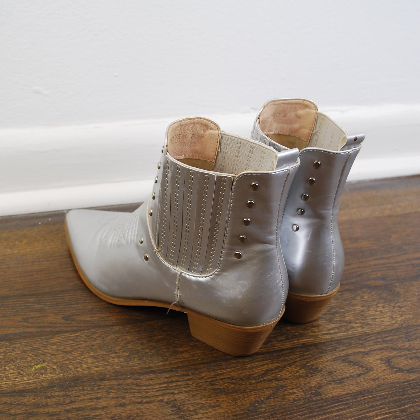 Metallic door handle on a wooden door