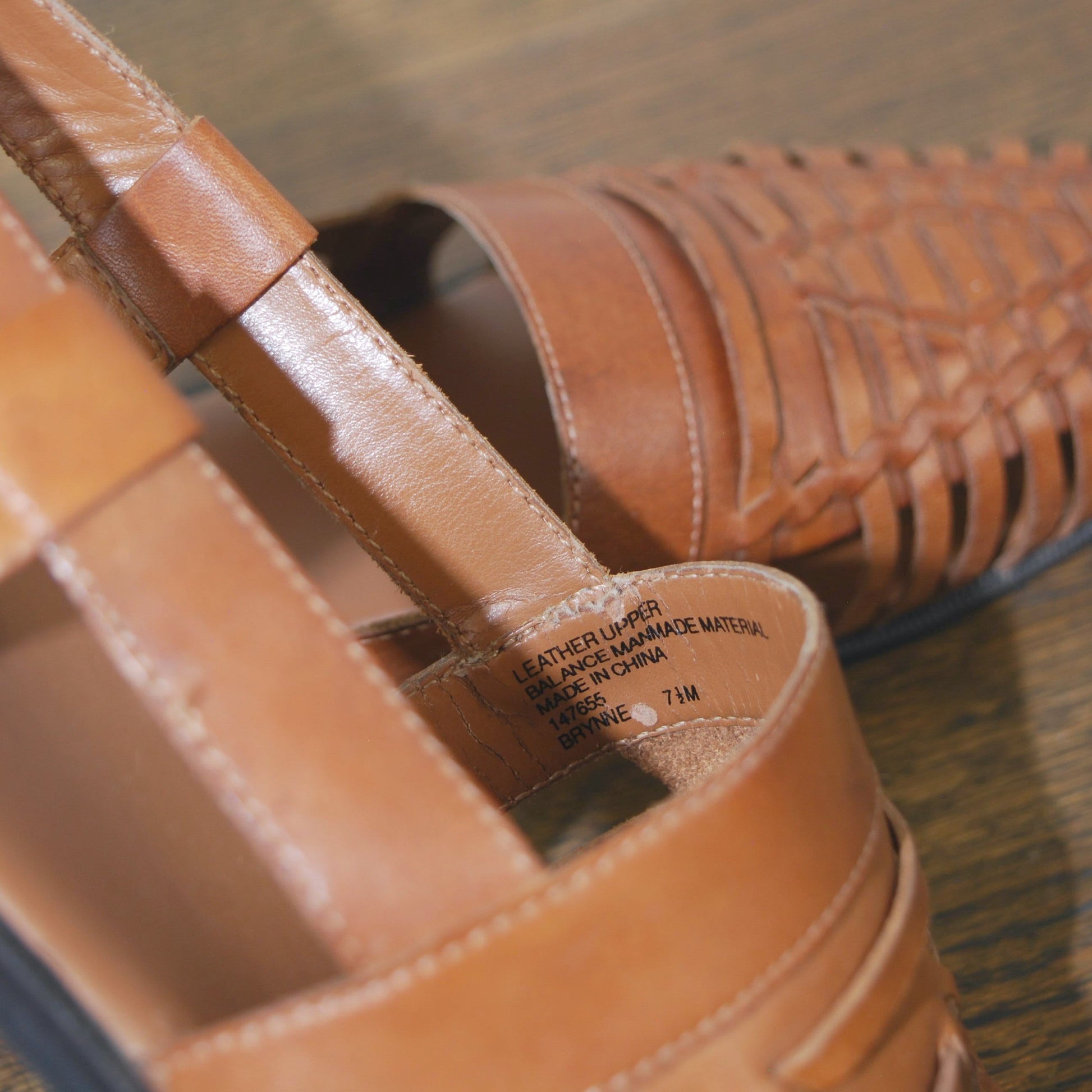 Close-up of brown leather shoes with a blurred background