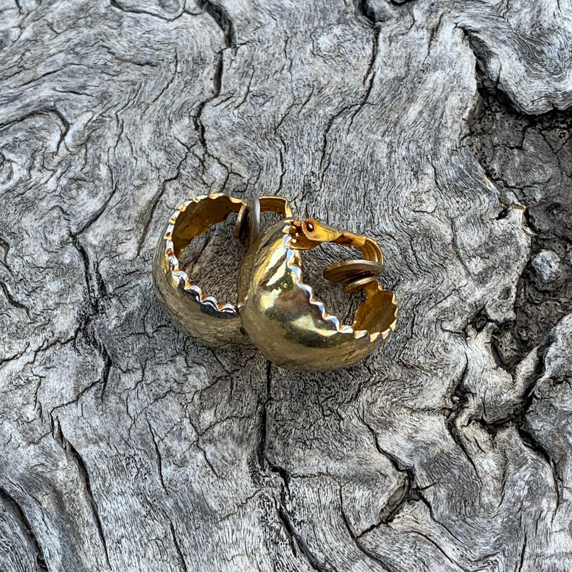 Gold ring on a textured stone surface