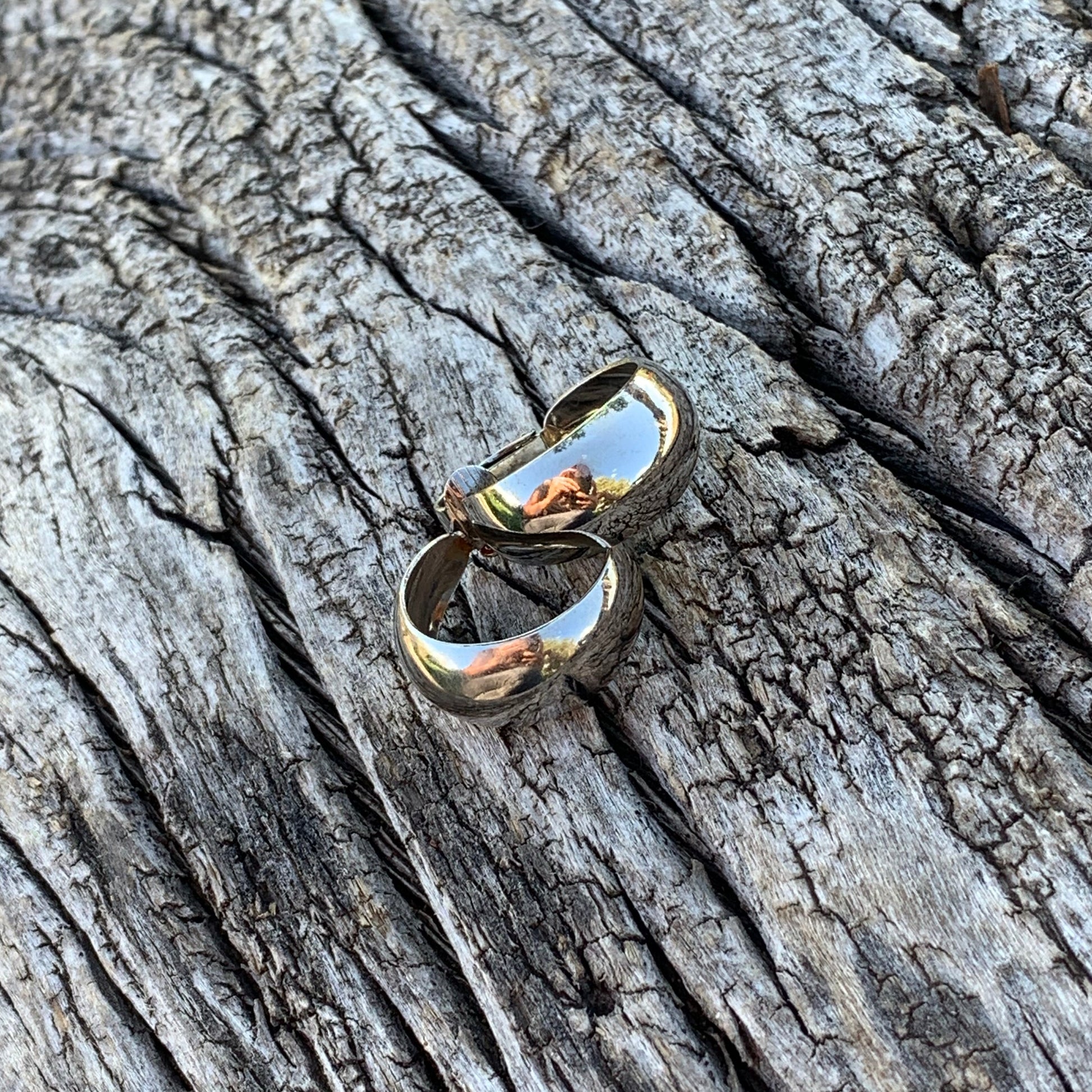 Gold ring on a textured wooden surface