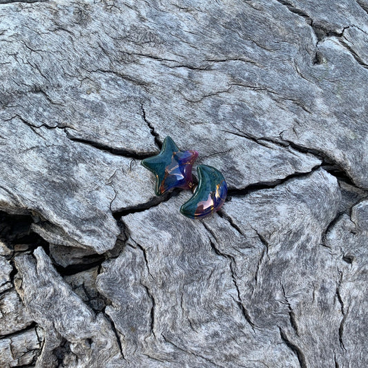 Multicolored butterfly on a textured gray rock surface